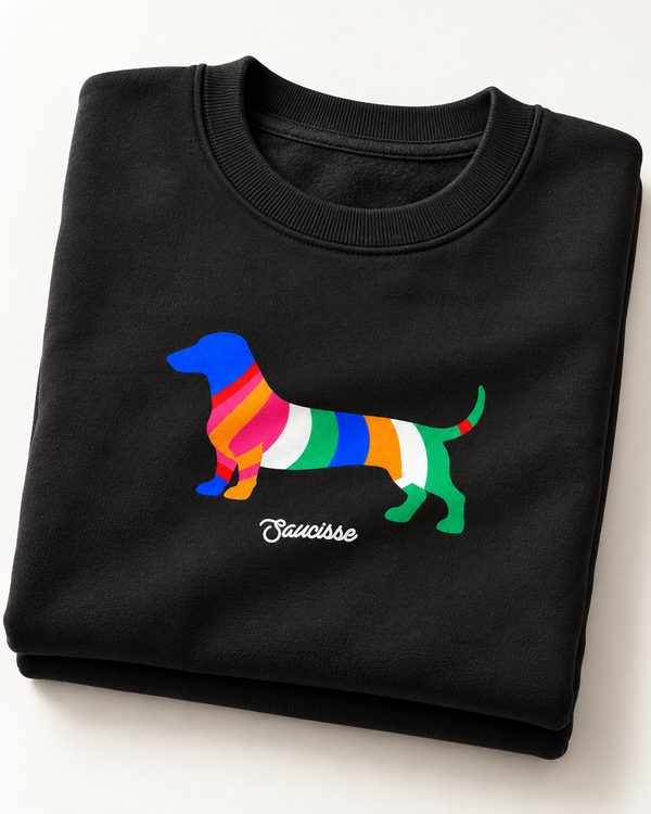 Black Saucisse Colour Me Dachshund unisex sweater folded to show the colourful striped dachshund front print and white Saucisse signature.