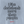 Close-up of the centred rear artwork on the Aquamarine Saucisse I Like Dachshunds More Than People sweater, showing outline lettering and red signature.