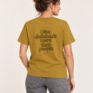 Rear studio view of the Ochre Saucisse I Like Dachshunds More Than People unisex T-shirt, with centred outline artwork raised slightly towards the shoulders.