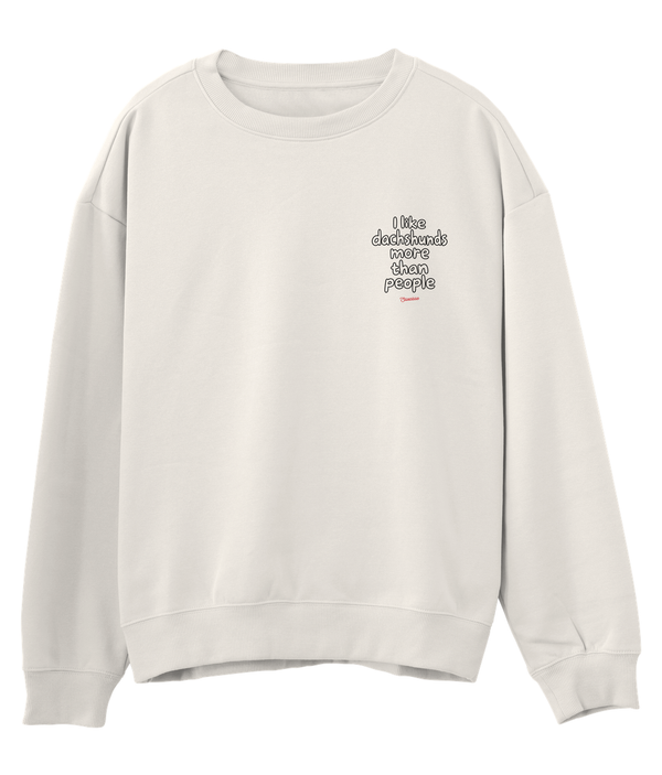 Ivory Saucisse I Like Dachshunds More Than People unisex sweater, front view with a small left-chest print and red signature.