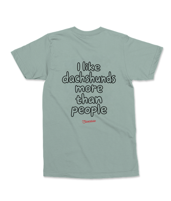 Aloe Saucisse I Like Dachshunds More Than People unisex T-shirt, rear view with centred outline lettering and red Saucisse signature, raised slightly towards the shoulders.