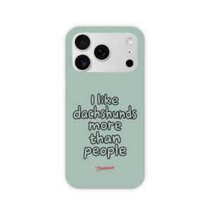 Saucisse sage-green high gloss phone case with “I like dachshunds more than people” lettering and a red signature.