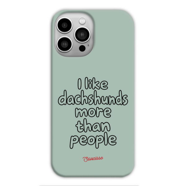 Saucisse sage-green phone case for iPhone 13 Pro, with “I like dachshunds more than people” lettering and a red signature.