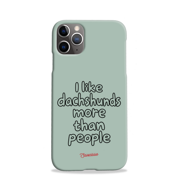 Saucisse sage-green phone case for iPhone 11 Pro, with “I like dachshunds more than people” lettering and a red signature.