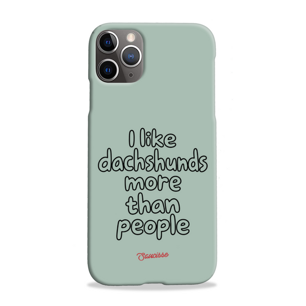 Saucisse sage-green phone case for iPhone 11 Pro Max, with “I like dachshunds more than people” lettering and a red signature.