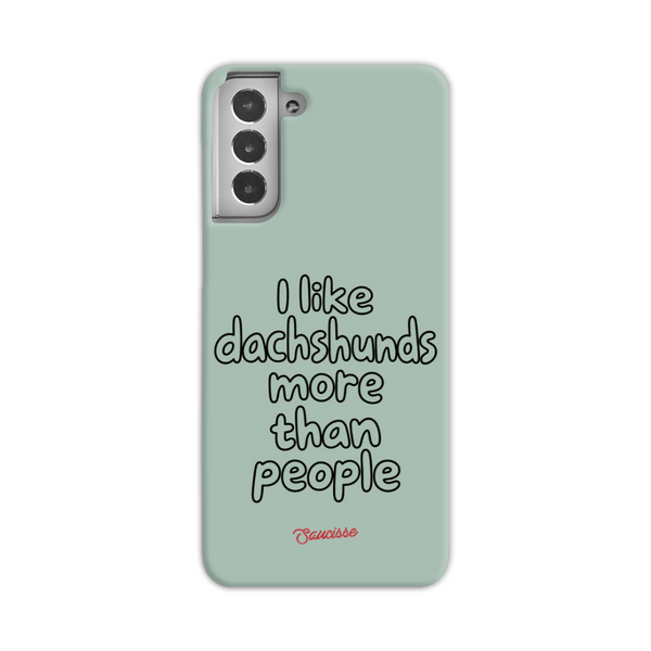 Saucisse sage-green phone case for Galaxy S21, with “I like dachshunds more than people” lettering and a red signature.