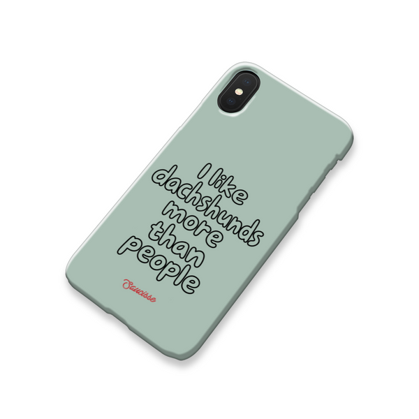 Angled rear view of the green Saucisse phone case with black outline lettering and the red Saucisse signature.