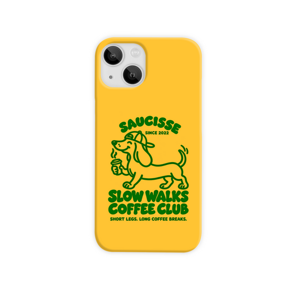 Saucisse yellow case with green dachshund artwork and Slow Walks Coffee Club lettering, showing the printed back and model-specific camera opening.