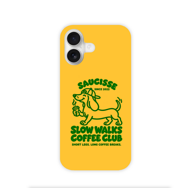Saucisse yellow case with green dachshund artwork and Slow Walks Coffee Club lettering, showing the printed back and model-specific camera opening.