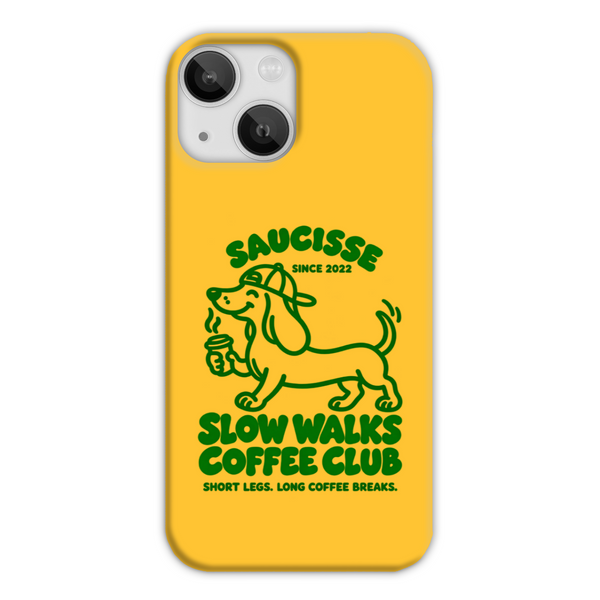 Saucisse yellow case with green dachshund artwork and Slow Walks Coffee Club lettering, showing the printed back and model-specific camera opening.