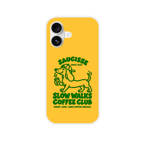 Saucisse yellow case with green dachshund artwork and Slow Walks Coffee Club lettering, showing the printed back and model-specific camera opening.