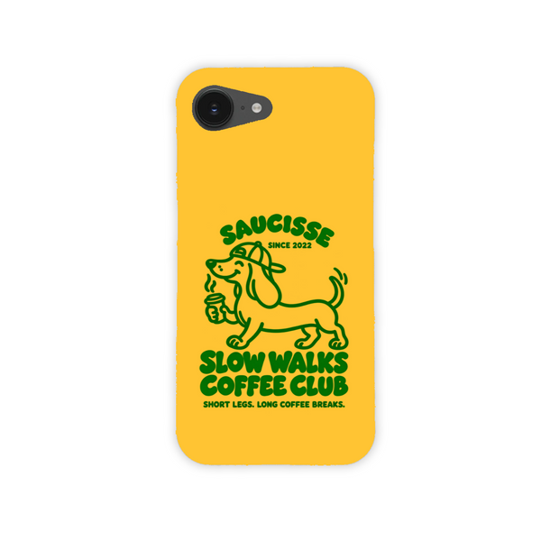 Saucisse yellow case with green dachshund artwork and Slow Walks Coffee Club lettering, showing the printed back and model-specific camera opening.
