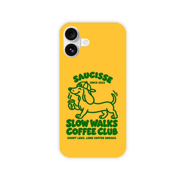 Saucisse yellow case with green dachshund artwork and Slow Walks Coffee Club lettering, showing the printed back and model-specific camera opening.