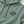 Close-up of the Jade Green Saucisse hoodie chest print, cotton texture and matching drawcords with metal tips.