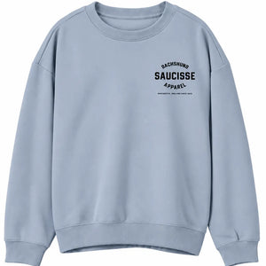 Front of Saucisse Manchester England unisex sweater in Aquamarine, with small black left-chest Dachshund Apparel logo