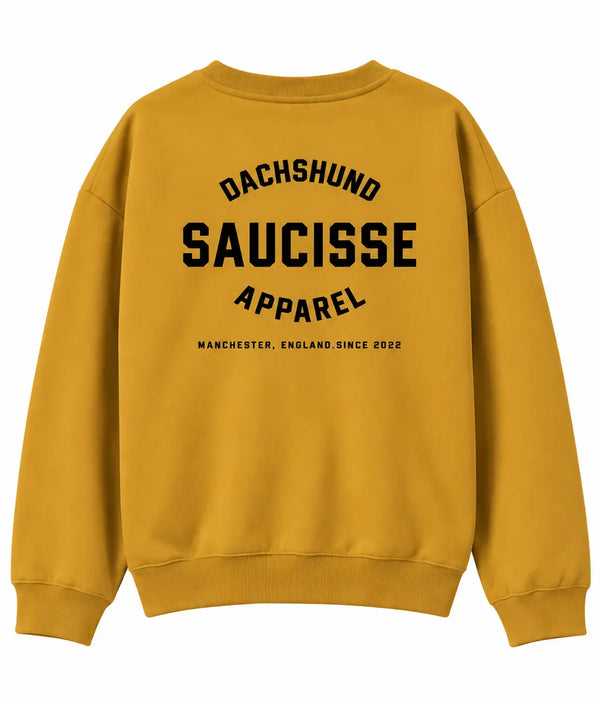 Back of Saucisse Manchester England unisex sweater in Curcuma, with centred black Dachshund Apparel print