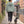 Back of the Jade Green Saucisse Manchester England unisex sweater worn on a canal walk with a dachshund