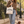 Woman carrying a Natural Raw Dachshund Kind of Person tote while walking a dachshund