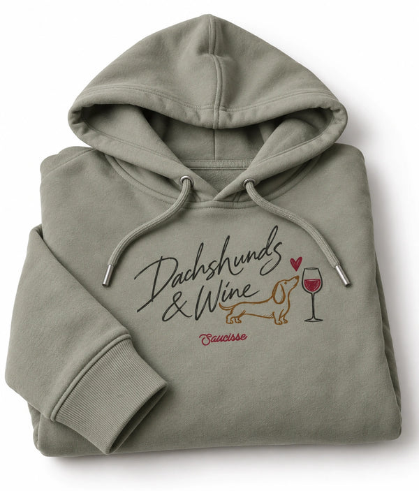 Folded Almond Green Saucisse Dachshunds & Wine hoodie, showing the chest print, matching drawcords and substantial fleece fabric.