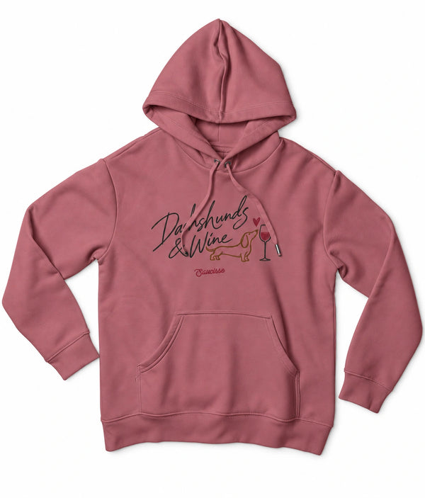 Front view of the Antique Rose Saucisse Dachshunds & Wine women's hoodie, with matching drawcords and a centred dachshund and wine print.