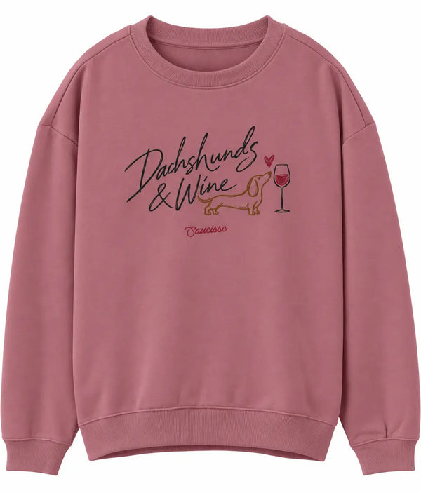 Front view of the Saucisse Dachshunds & Wine sweater in Antique Rose, showing the chest artwork.
