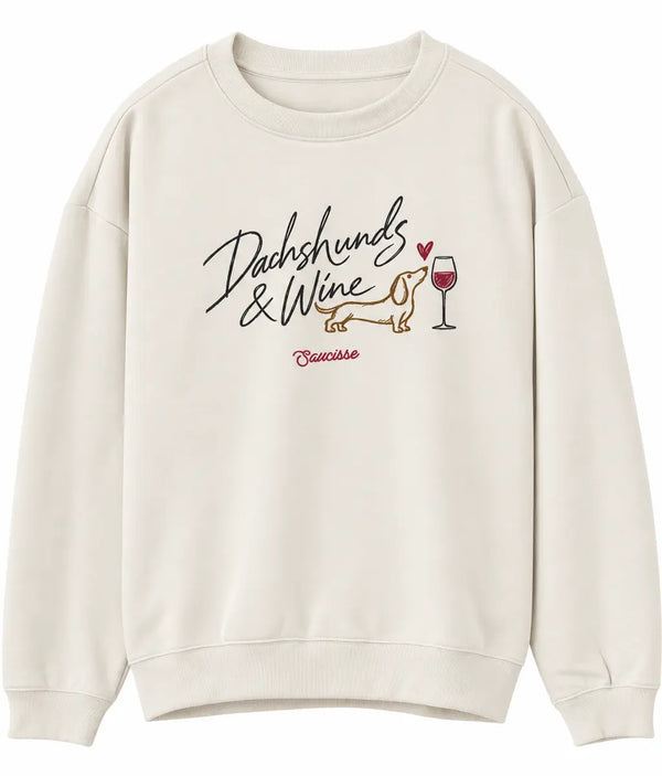 Front view of the Saucisse Dachshunds & Wine sweater in Ivory, showing the chest artwork.