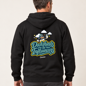 Model wearing the Saucisse Dachshunds Are the New Influencers black hoodie, rear view in a warm neutral studio