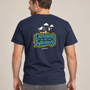 Model wearing the Saucisse Dachshunds Are the New Influencers French Navy T-shirt in a neutral studio, rear view showing the smaller centred back print