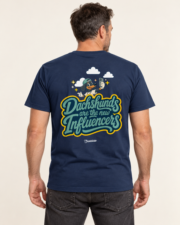 Model wearing the Saucisse Dachshunds Are the New Influencers French Navy T-shirt, rear view in a warm neutral studio