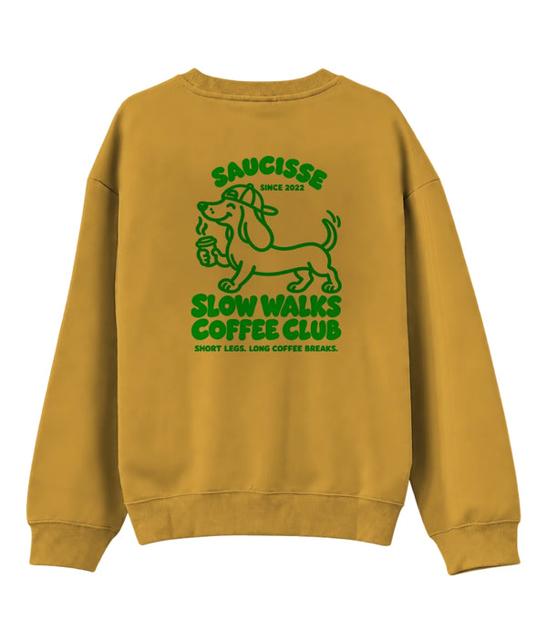 Saucisse Slow Walks Coffee Club unisex sweater in Curcuma, back view with centred green dachshund coffee artwork