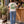 Saucisse Slow Walks Coffee Club unisex T-shirt in Vintage White, rear coffee-stop lifestyle view with green back print and a dachshund on a lead