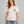Saucisse Slow Walks Coffee Club unisex T-shirt in Vintage White, front studio view with small green left-chest print