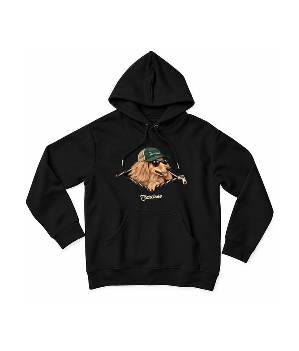 Saucisse Unzipped long-haired unisex hoodie in Black, front view showing a long-haired dachshund in a green cap and sunglasses emerging from a printed zip.