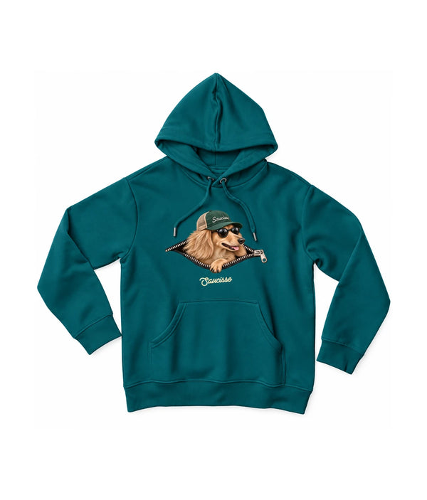 Saucisse Unzipped long-haired unisex hoodie in Peacock Green, front view showing a long-haired dachshund in a green cap and sunglasses emerging from a printed zip.