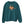 Saucisse Unzipped long-haired unisex sweater in Peacock Green, front view showing a long-haired dachshund in a green cap and sunglasses emerging from a printed zip.
