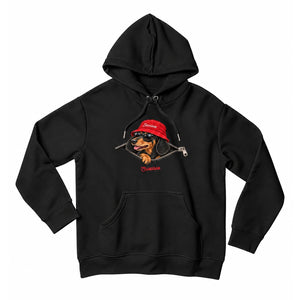 Front view of the Black Saucisse Unzipped Short Haired unisex hoodie, with a dachshund in a red Saucisse bucket hat and sunglasses peeping through an illustrated zip and a red Saucisse signature.