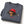 Folded Mineral Grey Saucisse Unzipped Short Haired unisex sweater on a white studio background, showing a dachshund in a red Saucisse bucket hat and sunglasses peeping through an illustrated zip and the red signature.