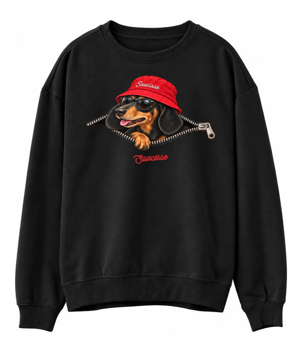 Front view of the Black Saucisse Unzipped Short Haired unisex sweater, with a dachshund in a red Saucisse bucket hat and sunglasses peeping through an illustrated zip and a red Saucisse signature.