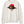 Front view of the Ivory Saucisse Unzipped Short Haired unisex sweater, with a dachshund in a red Saucisse bucket hat and sunglasses peeping through an illustrated zip and a red Saucisse signature.