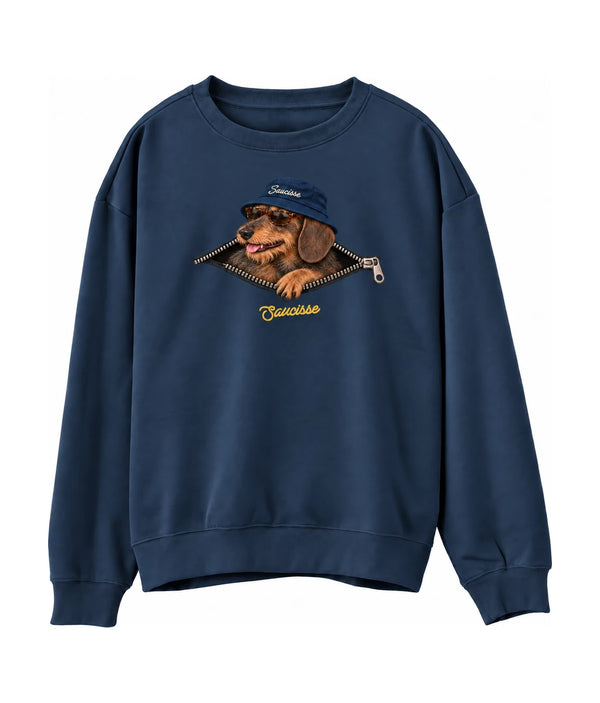 Front of the Saucisse Unzipped wire-haired unisex sweater in Peacock Blue, with a navy-hat dachshund, printed silver zip and gold Saucisse signature.