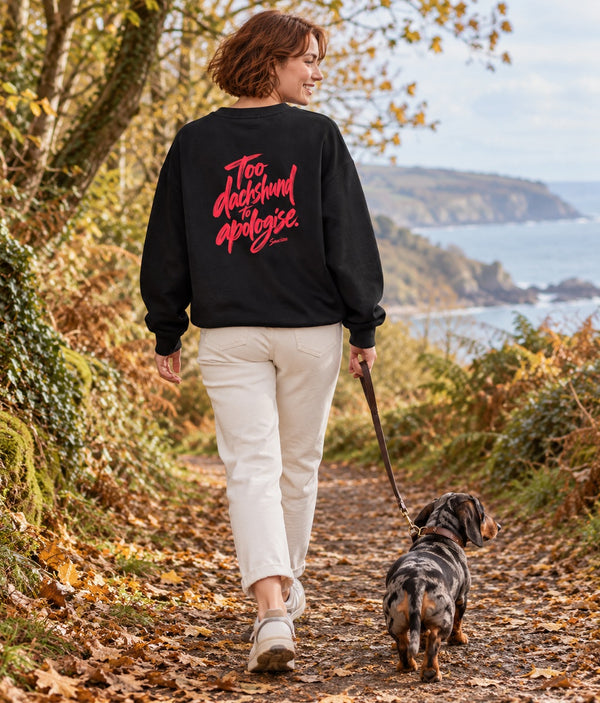 Saucisse Too Dachshund to Apologise black Sweatshirt, back lifestyle photograph with woman and dachshund.