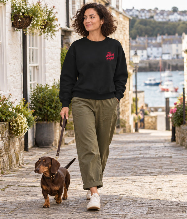 Saucisse Too Dachshund to Apologise black Sweatshirt, front lifestyle photograph with woman and dachshund.
